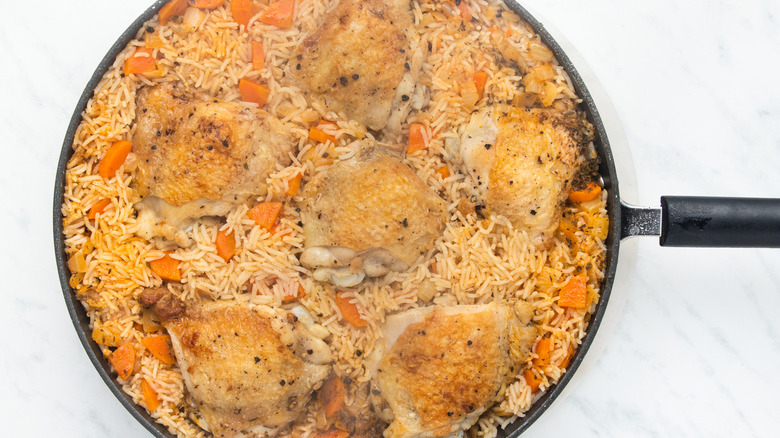 rice and chicken in pan 