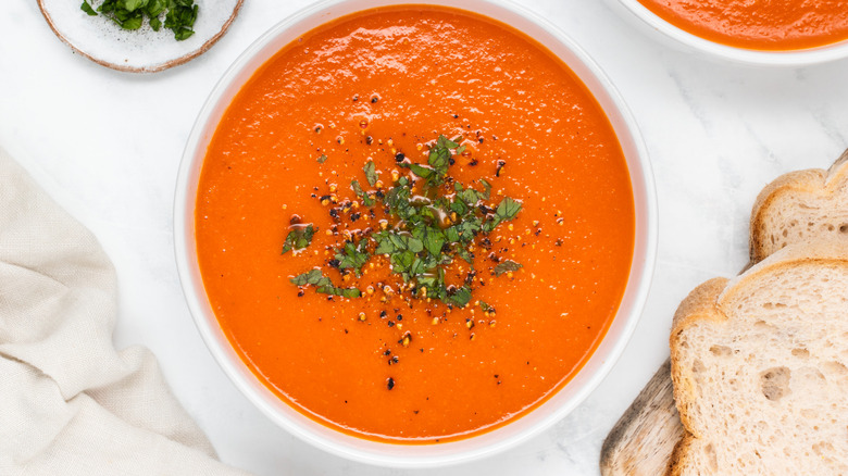 bowl of soup with parsley garnish