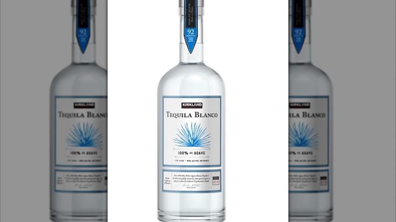 A bottle each of Kirkland Blanco and Anejo tequilas in a shopping cart