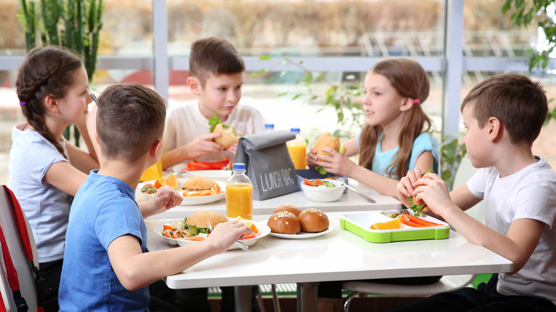 Kids sitting at a cafeteria table