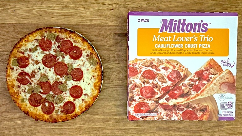 Package and baked Milton's Meat Lover's Cauliflower Crust Pizza on round plate