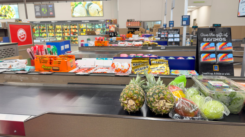 Aldi checkout area with snacks and stuff on conveyor belt