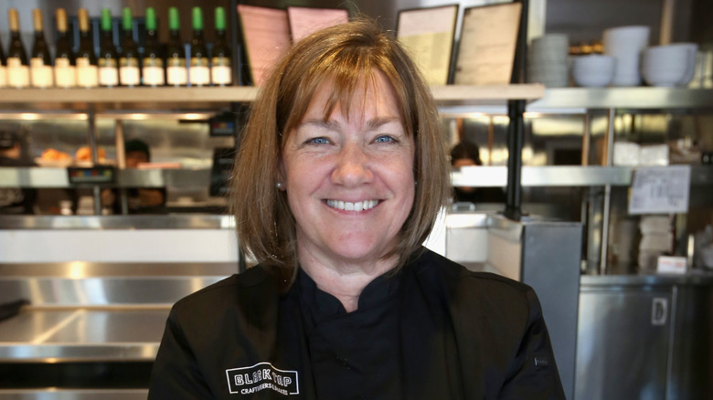 Portrait photo of celebrity chef Gale Gand in a kitchen