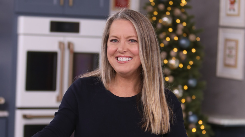 Celebrity chef Melissa d'Arabian in a kitchen with festive lights in the background