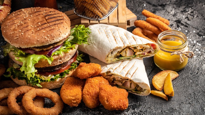 chicken nuggets, burger, and onion rings