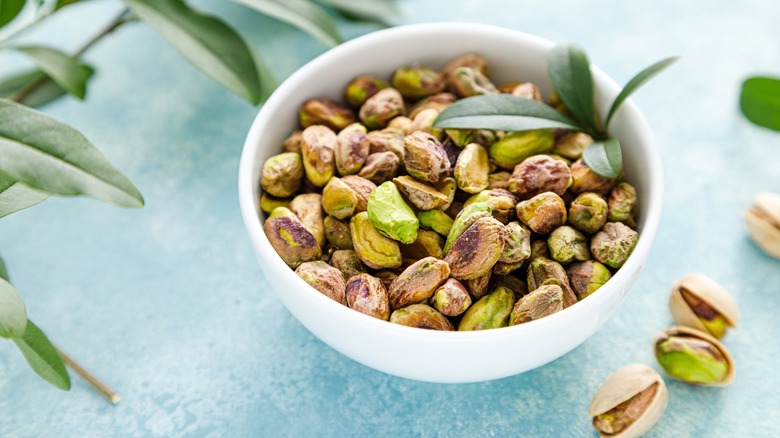 bowl of pistachios on table