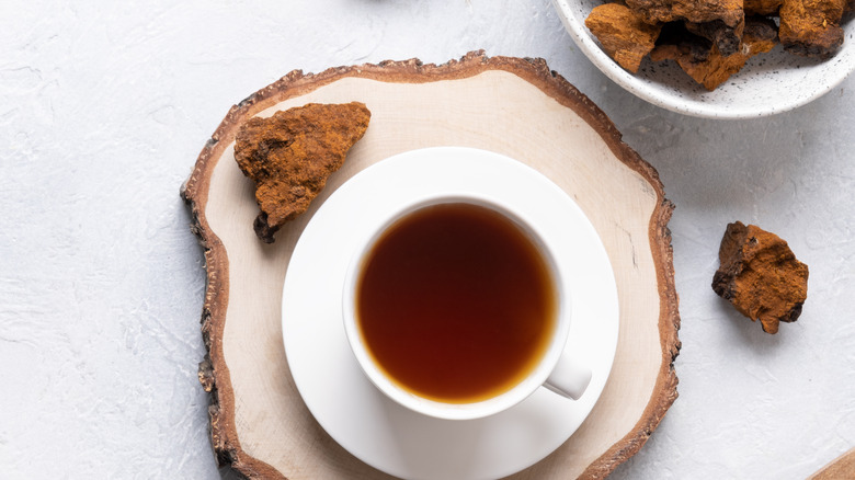 ground mushroom coffee next to brewed cup