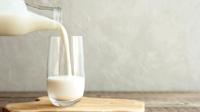 Pouring glass of milk