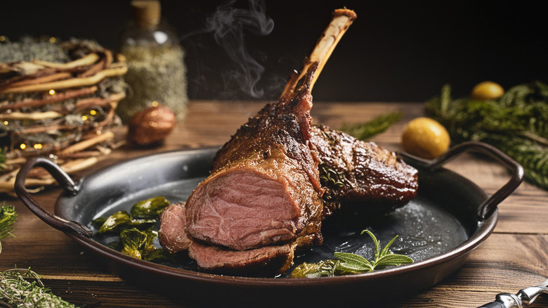 Roasted leg of lamb on a metal platter