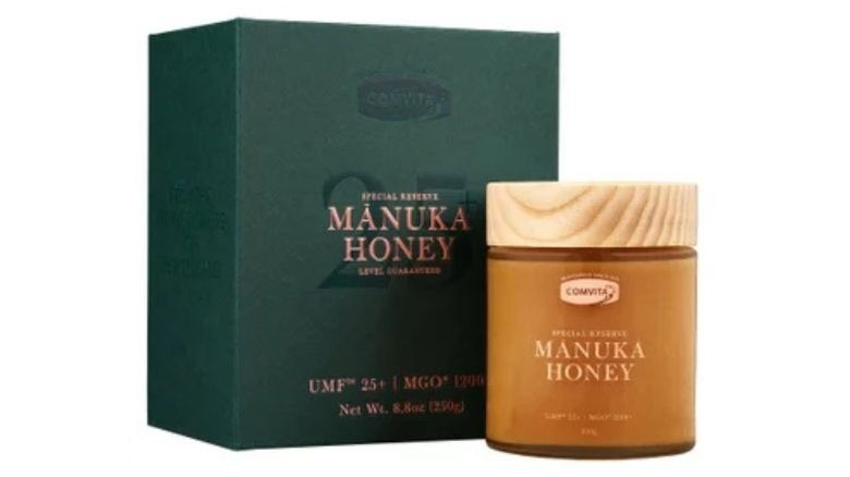 Dipping into a container of honey