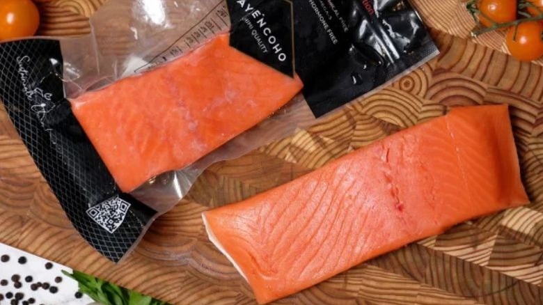 Numerous slices of salmon sashimi