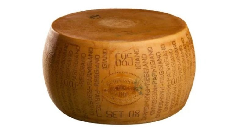 A wheel of parmigiano cracked open