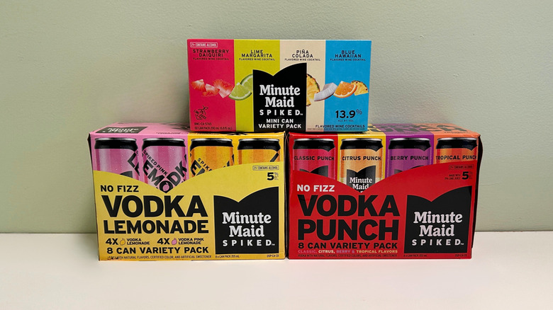 Three different packs of Minute Maid Spiked products against a green and white background