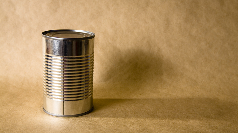 can on brown paper background