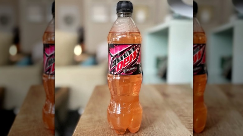 Mountain Dew Supernova Bottle sitting on wooden surface