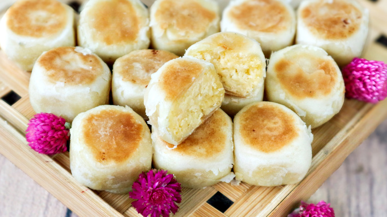 A display of hopia arranged with one cut open to show the filling