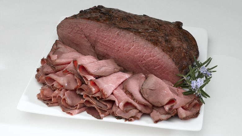 Roast beef joint, with slices cut from it