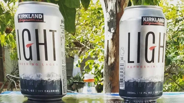Two cans of Kirkland Signature light lager