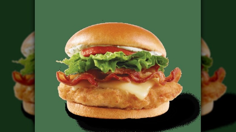 a Asiago Ranch Classic Chicken Club against a green background.