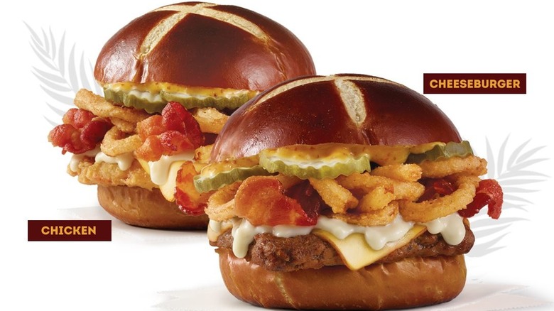 a Pretzel Pub Cheeseburger and Pretzel Pub Chicken Sandwich against a white background.