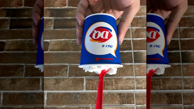 Hand holding DQ blizzard upside down