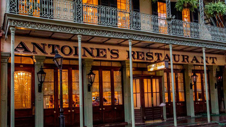 An exterior shot of a New Orleans restaurant with a balcony.