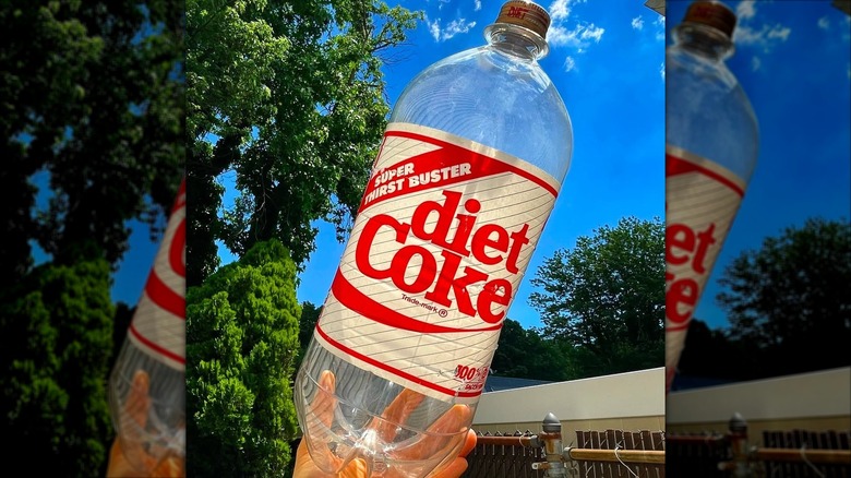 A large, vintage plastic Coke bottle.