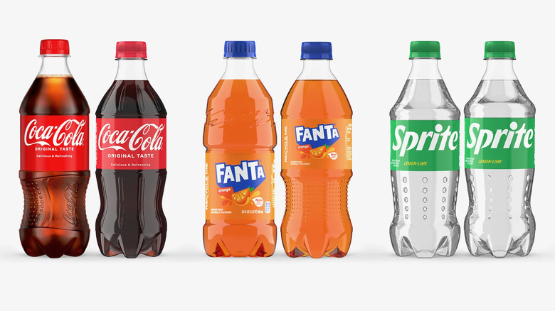 Some 2024 plastic bottles for Coca-Cola, Fanta, and Sprite, showing their different designs.