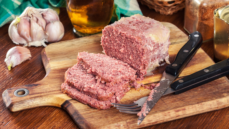 Sliced corned beef on cutting board