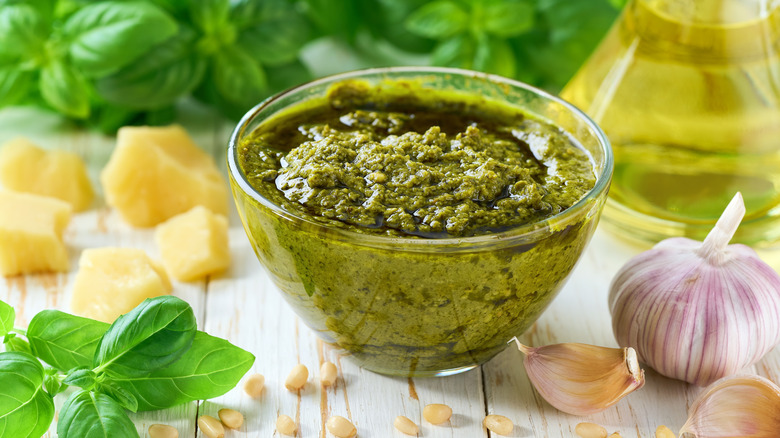 Glass cup of pesto sauce