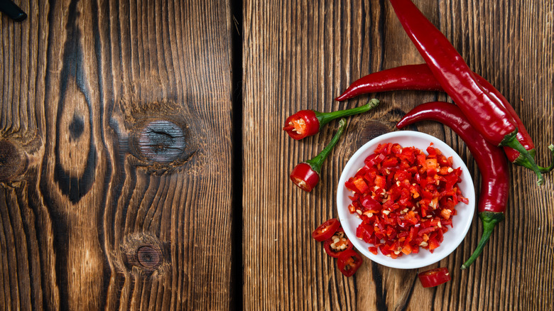 Red chilis diced in a bowl