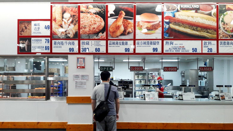 A man stands in the food court of a Taiwanese Costco
