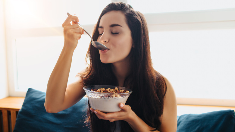 woman eating cereal