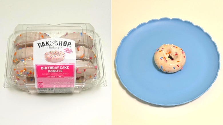 A box of Bake Shop Birthday Cake Donuts next to a blue plate with a donut