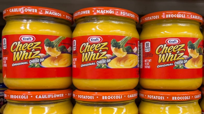 Jars of Cheez Whiz on the shelf in the grocery store