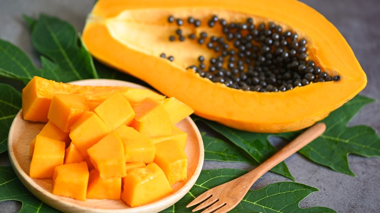 Papaya sliced in half and chopped