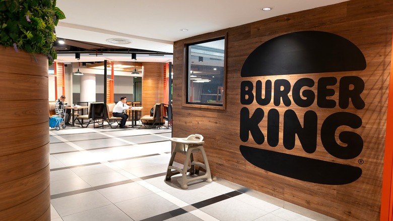 Woman ordering food at Burger King's self service kiosk