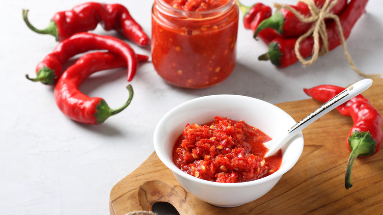 Hot sauce in jar, bowl