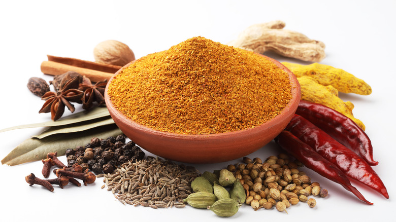 seasoning powder surrounded by whole spices