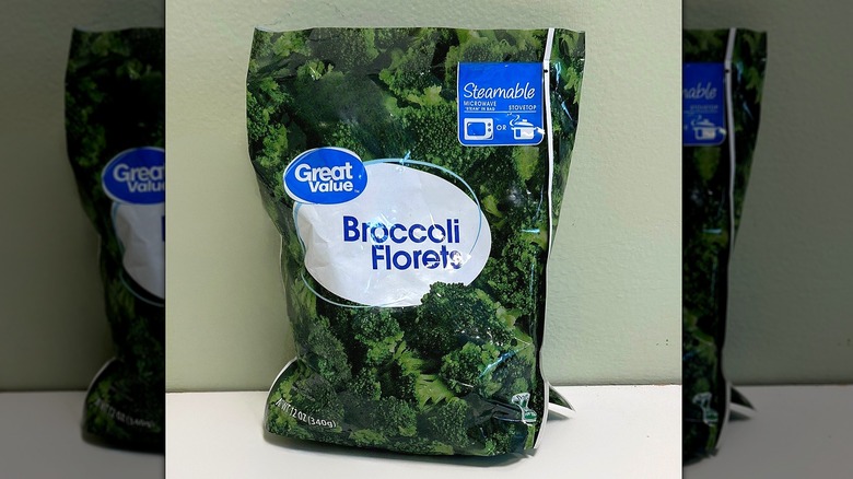 A bag of Great Value Broccoli Florets on a white and green background