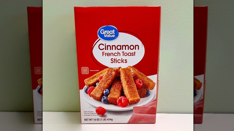 A box of Great Value Cinnamon French Toast Sticks on a green and white background