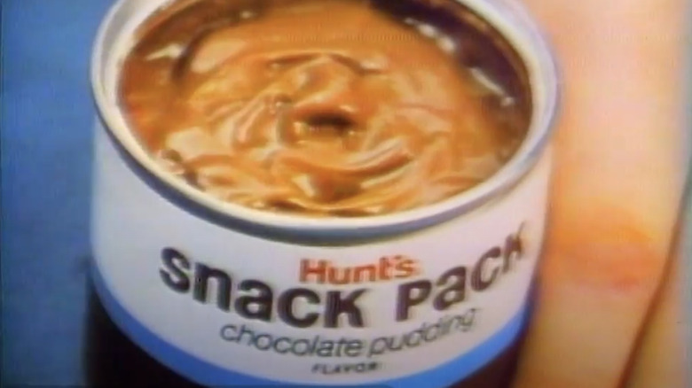Still from a 1970s Hunt's Snack Pack commercial, showing an open can of Hunt's Snack Pack Chocolate Pudding