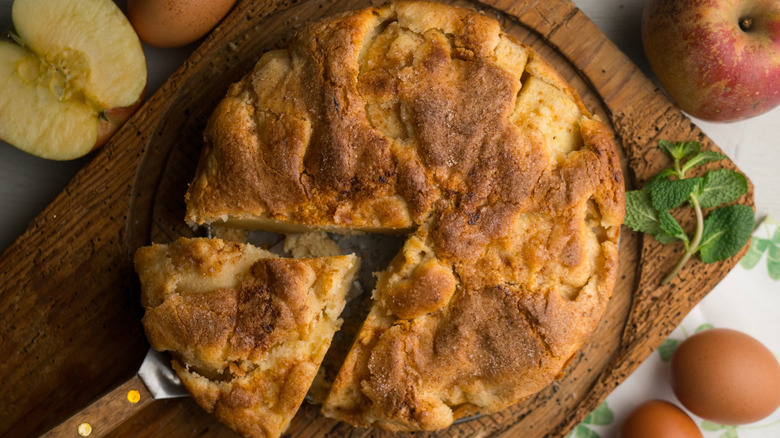 A German Apple Cake on a wooden platter