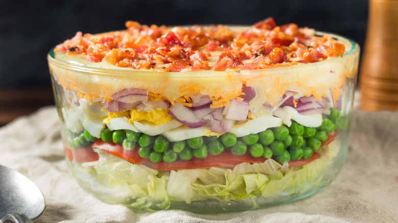 Classic 7-layer salad in a glass trifle bowl