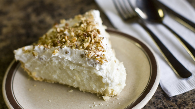 Slice of Million Dollar Pie on a rustic plate