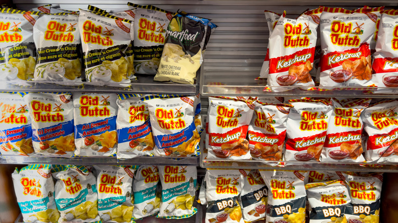 a variety of Old Dutch chip flavors on a store wall.