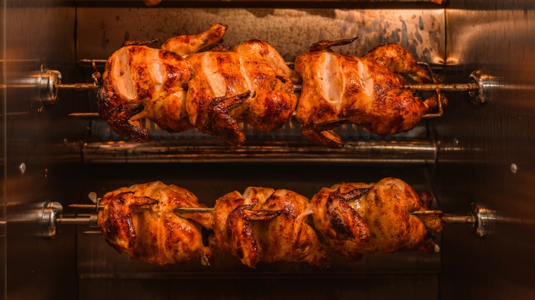 Rotisserie chickens in a rotisserie oven