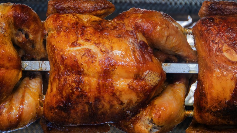 Rotisserie chickens on a rotisserie rod