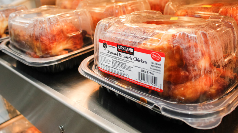 Rotisserie chickens packed in containers with necessary labels