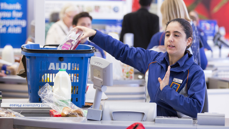 Aldi cashier sitting down